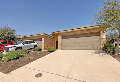 View of front facade featuring stone siding, conc