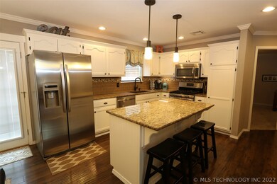 Bright kitchen re-do with center island, granite c