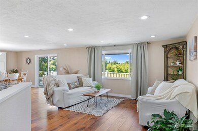 Main living room with windows overlooking the little farm.