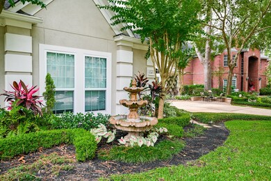 The fountain in the front stays with the home.