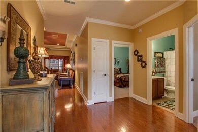 The entry foyer with its gleaming hardwood is warm and welcoming.