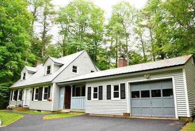 1 Car garage enters to an enormous connecting and heated  space  enjoining the main home to the outside.