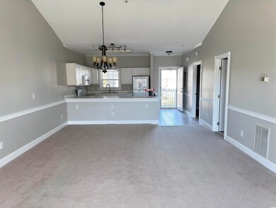 Kitchen with pendant lighting, appliances with sta