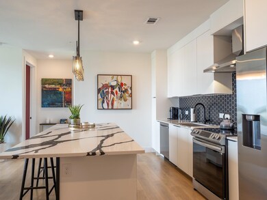 Kitchen with stainless steel appliances, wall chi
