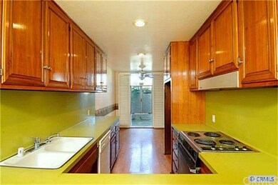 Galley kitchen with wood cabinets