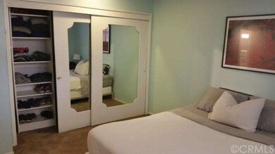 Bedroom with closet organizer/built ins