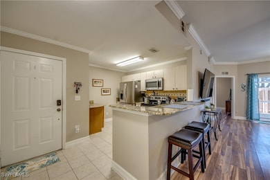 Kitchen featuring visible vents, crown molding, a