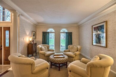 Formal living room, directly off foyer, has tray c