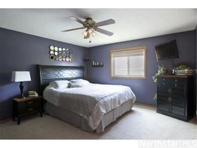 The master bedroom has a ceiling fan with a light.