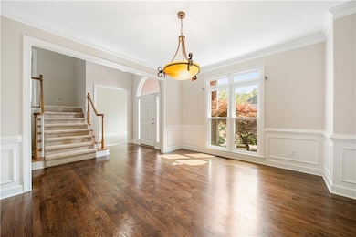 Unfurnished room featuring dark wood-type flooring