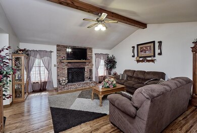 Vaulted great room with wood burning fireplace