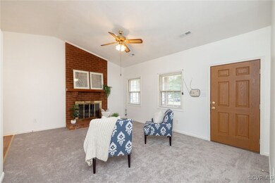 Family room featuring carpet floors, lofted ceilin