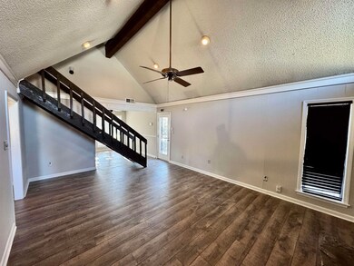 Unfurnished living room with dark hardwood / wood-