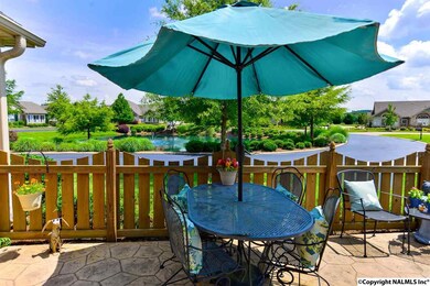 can be easily enjoyed.  Watch ducks play in the pond or squirrels scampering thru the trees.  Plenty of room on this patio for sitting areas.