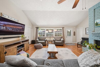 Spacious living room with tons of natural sunlight.