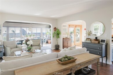 California bungalow style arches and shining hardwood floors accent this living area.