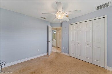 Unfurnished bedroom with baseboards, visible vents