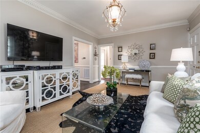 Living room with fireplace and dental molding