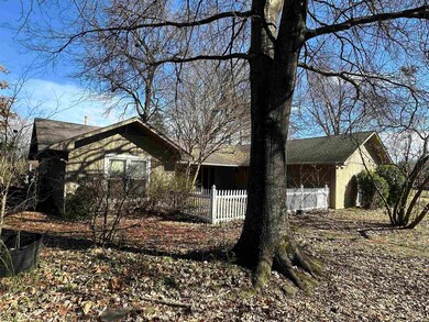 View of home's exterior with fence
