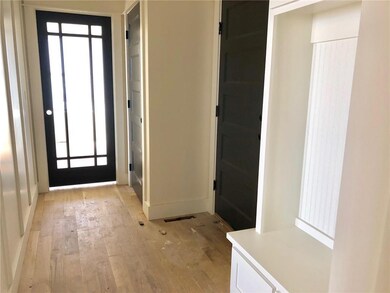 hall entering from Garage  / coat closet and door 