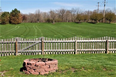 Fire Pit within the Fenced Back Yard.