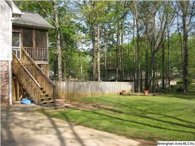 big side yard with access to fenced backyard and d