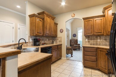 Kitchen has abundant counter space with tumbled ma