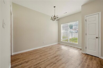 Unfurnished dining area featuring baseboards, a no