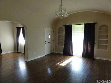Living room with large picture window and built in