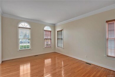 The living room offers crown moulding and decorati