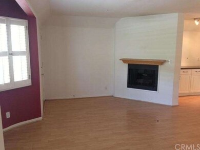 Front entry into living room with fireplace