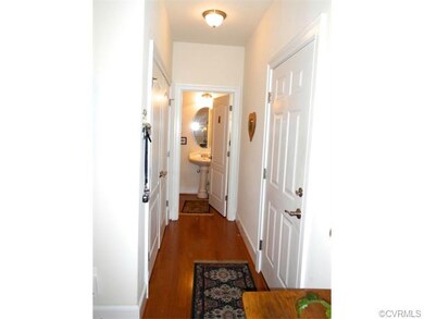 Hall to powder room, double door closet, and fully