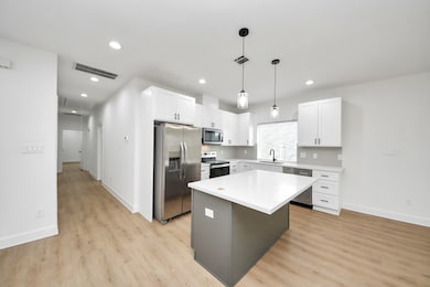The kitchen flows directly into the living space,