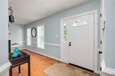 BAMBOO floorING entryway with a textured ceiling