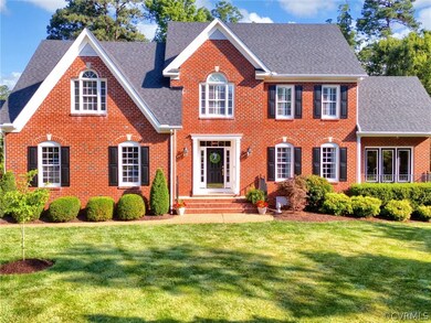 Colonial home with a front lawn
