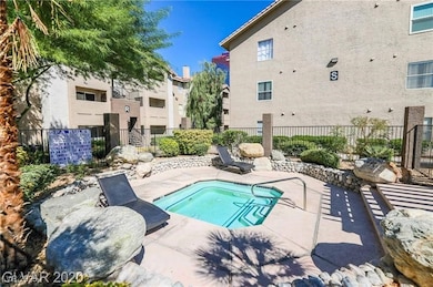 View of pool featuring fence and a patio area