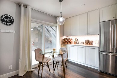 Dining area featuring baseboards, dark wood finis