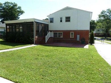 Rear view of this Beauty showing off Florida room,