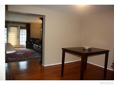 Kitchen Dining. Breakfast bar extends between kitc
