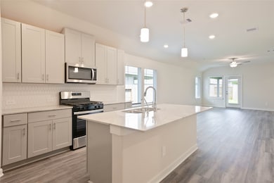 This photo showcases a modern open-concept kitchen