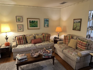 Living Room with Hardwood Flooring, which is featured in most of the home.