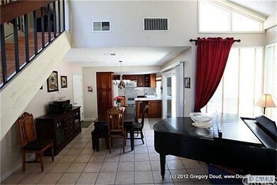 Living Room opens to Dining Room and Kitchen.