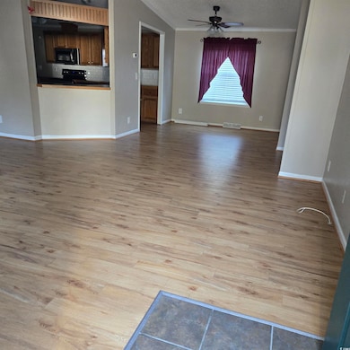 Unfurnished living room with a textured ceiling, l