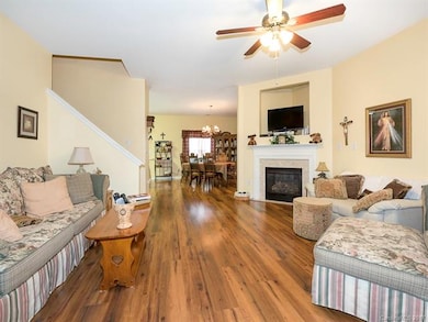 Great room with fireplace and view of Dining room