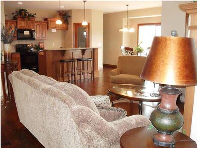 Open living area features handscraped wood floorin