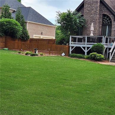 View of yard featuring a deck and stairway
