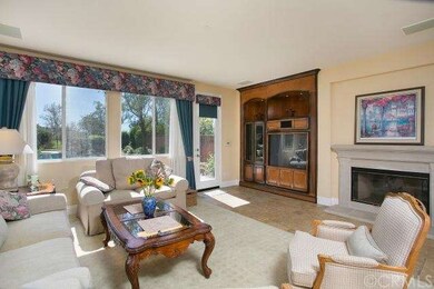 Family room with entertainment center and fireplac