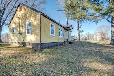 View of home's exterior featuring a lawn
