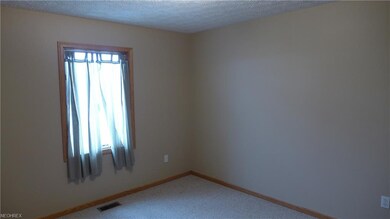Another bedroom with plenty of natural light and walk-in closet.