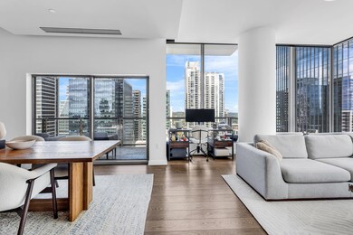 Living area with visible vents, wood finished flo